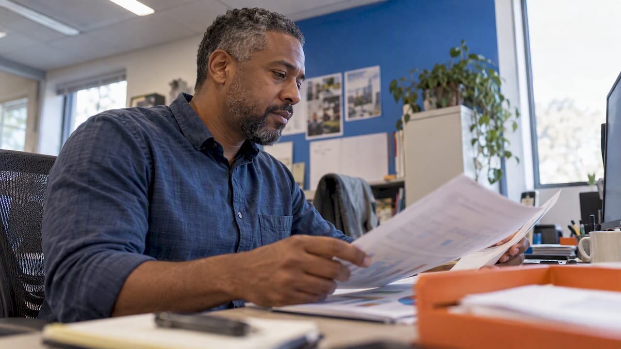 Analyst reviewing account attribution reports