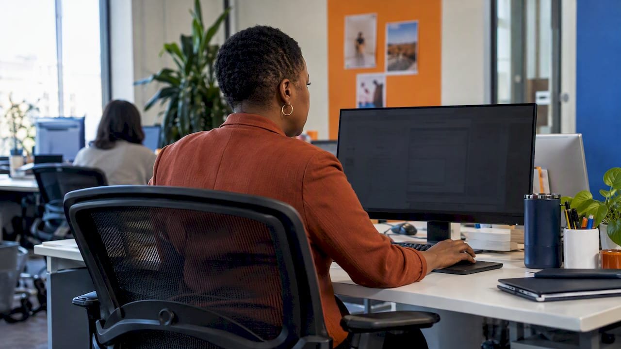 Strategist reviewing visitor behavior at a workstation